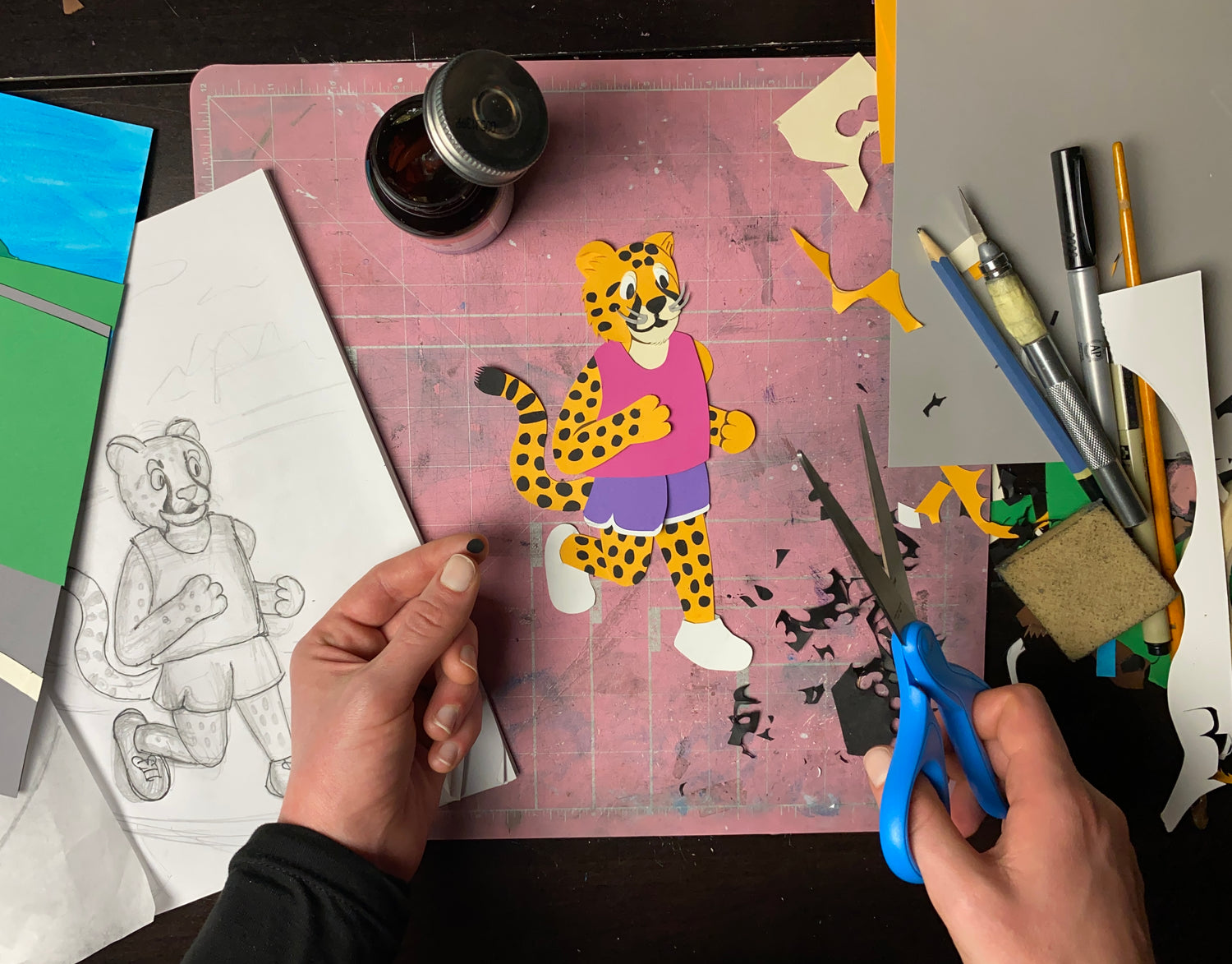 Each print is a reproduction of a hand-cut paper collage.